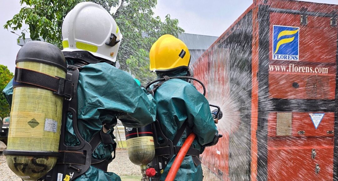 ASEC Firefighting training participants practising fire response