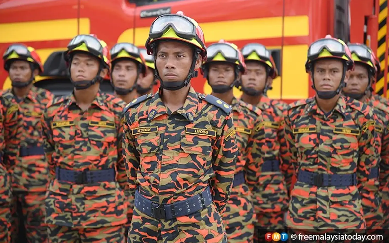 a group of firefighters standing together