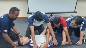 a group of man performing first aid training