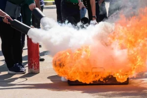 fire being extinguished with a fire extinguisher