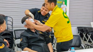a man bandaging somebody's head