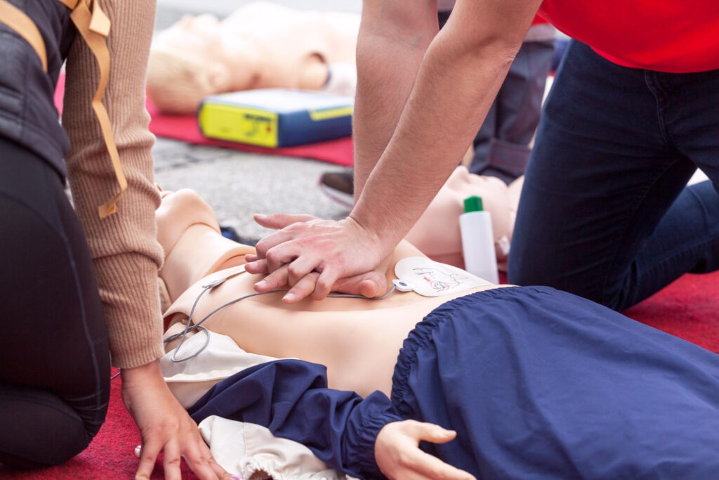 somebody performing CPR training