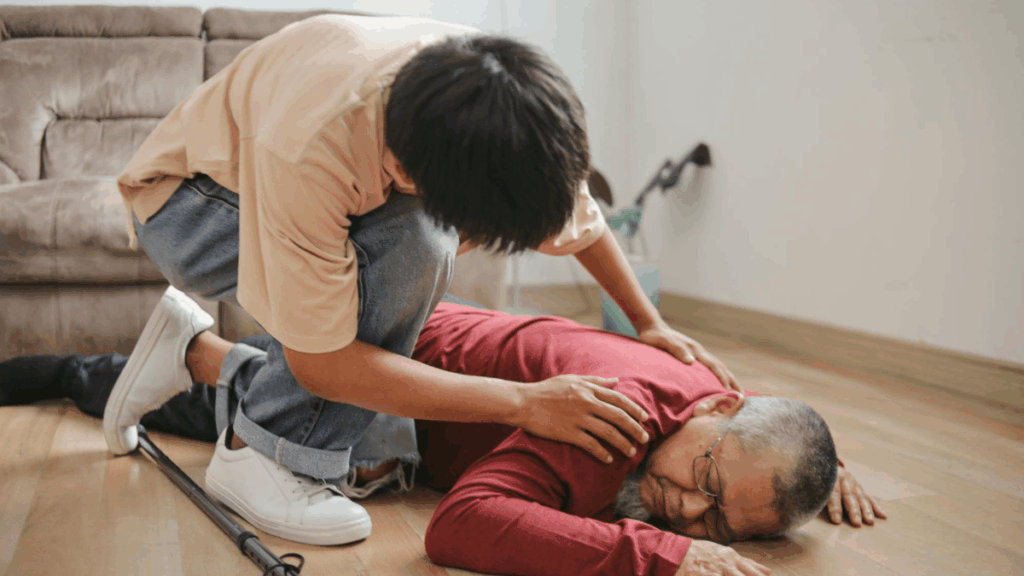 a man inspecting an unconscious old man