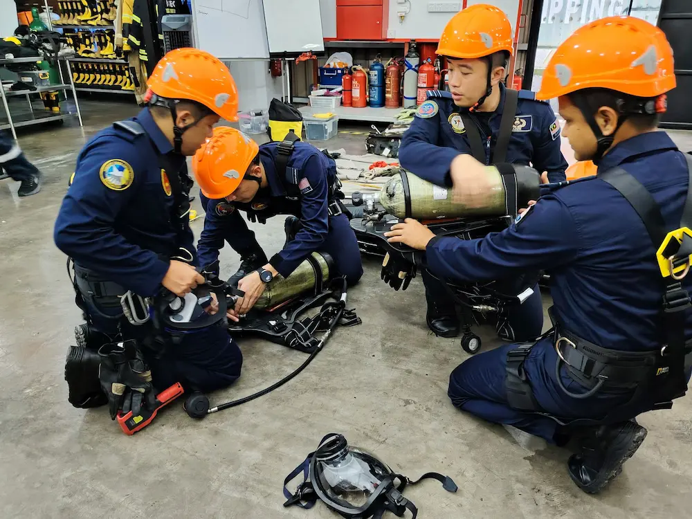 Royal Malaysia Air Force personnel involved in guided rescue practice at ASEC