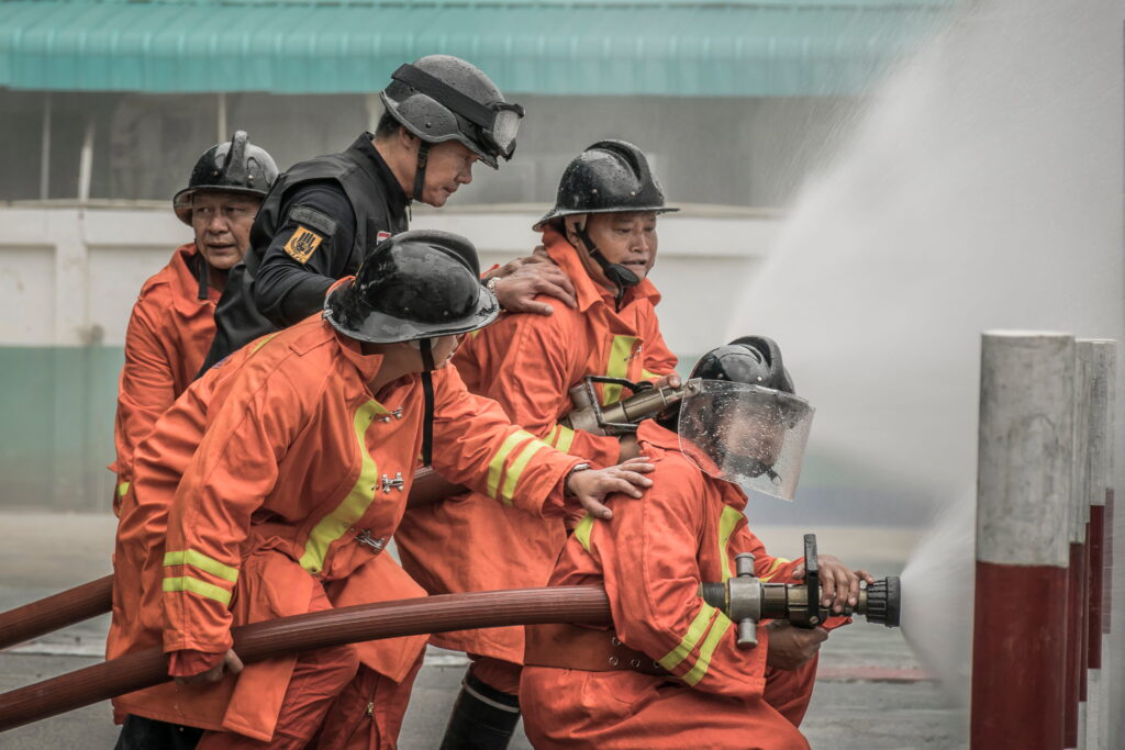 team of firefighters putting out fire